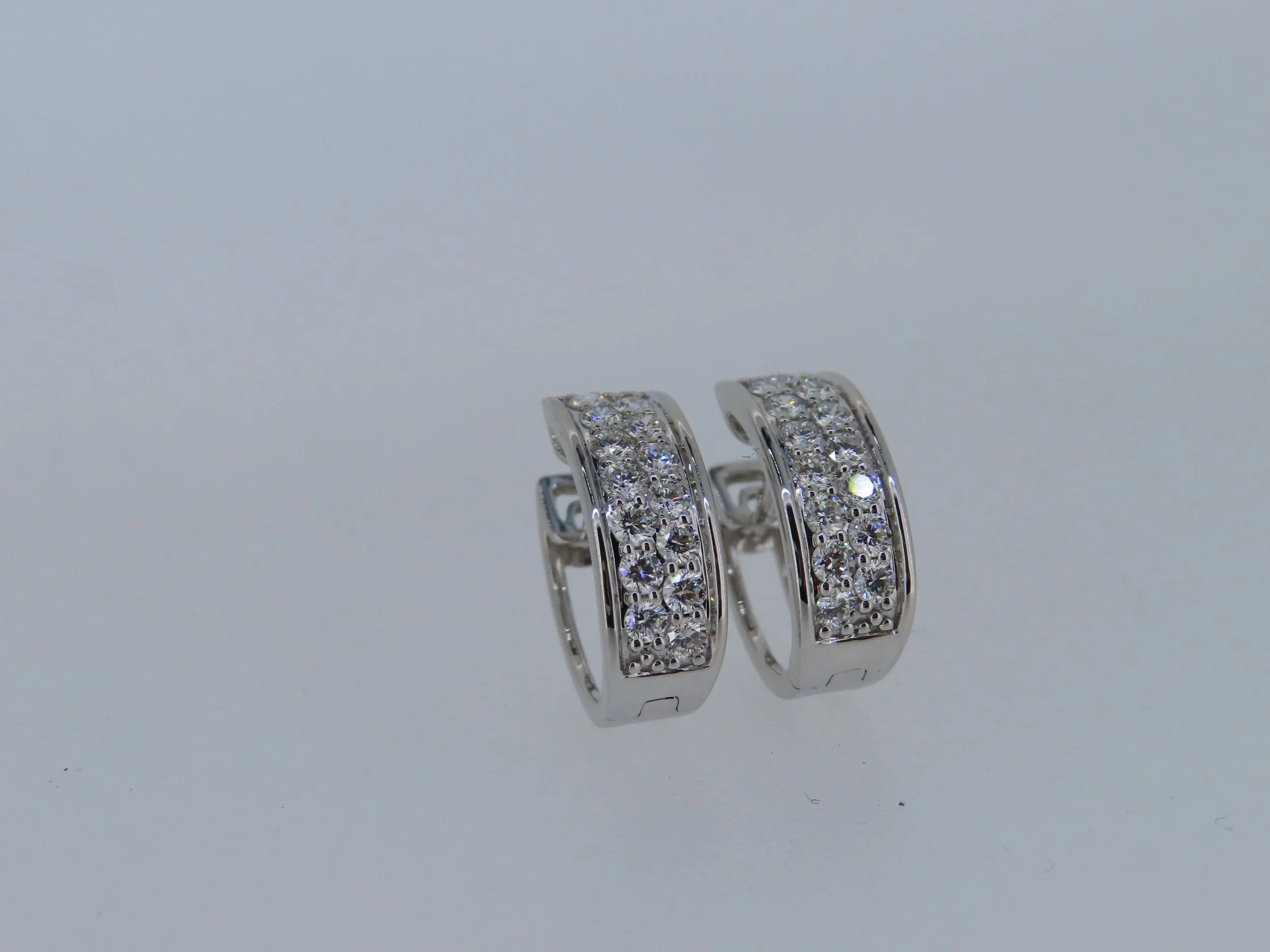 Oval diamond cluster hoops - hoop earrings | Greco Jewelers - styled view